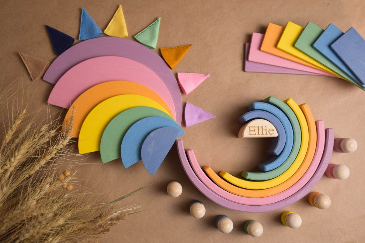 Handmade Montessori pastel rainbow building toy in wood and plywood with a natural wax-and-oil finish