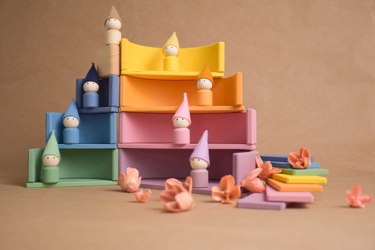 Handmade Montessori pastel rainbow building toy in wood and plywood with a natural wax-and-oil finish