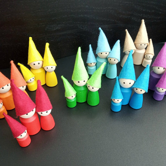 Wooden peg doll family with felt hats