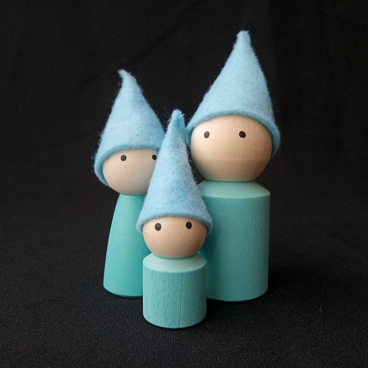 Linden wood mom, dad, and child peg dolls