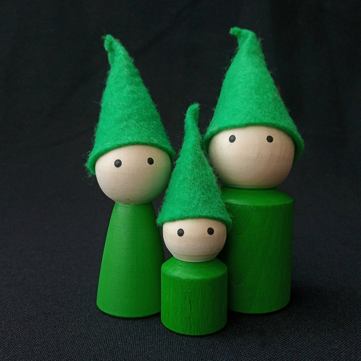 Wooden peg doll family with felt hats