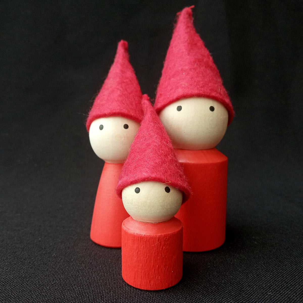 Linden wood mom, dad, and child peg dolls