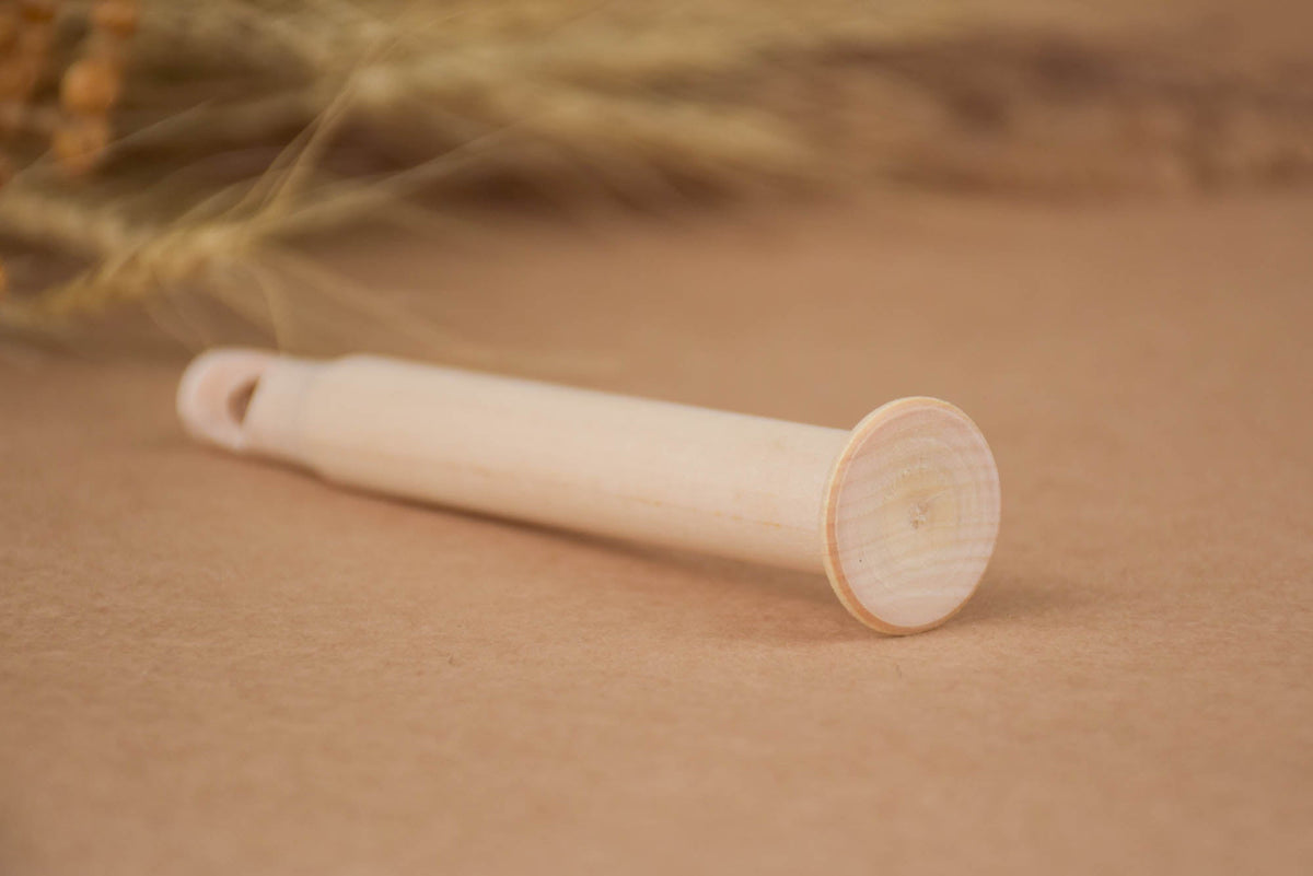 Wooden pull whistle toy made from linden wood