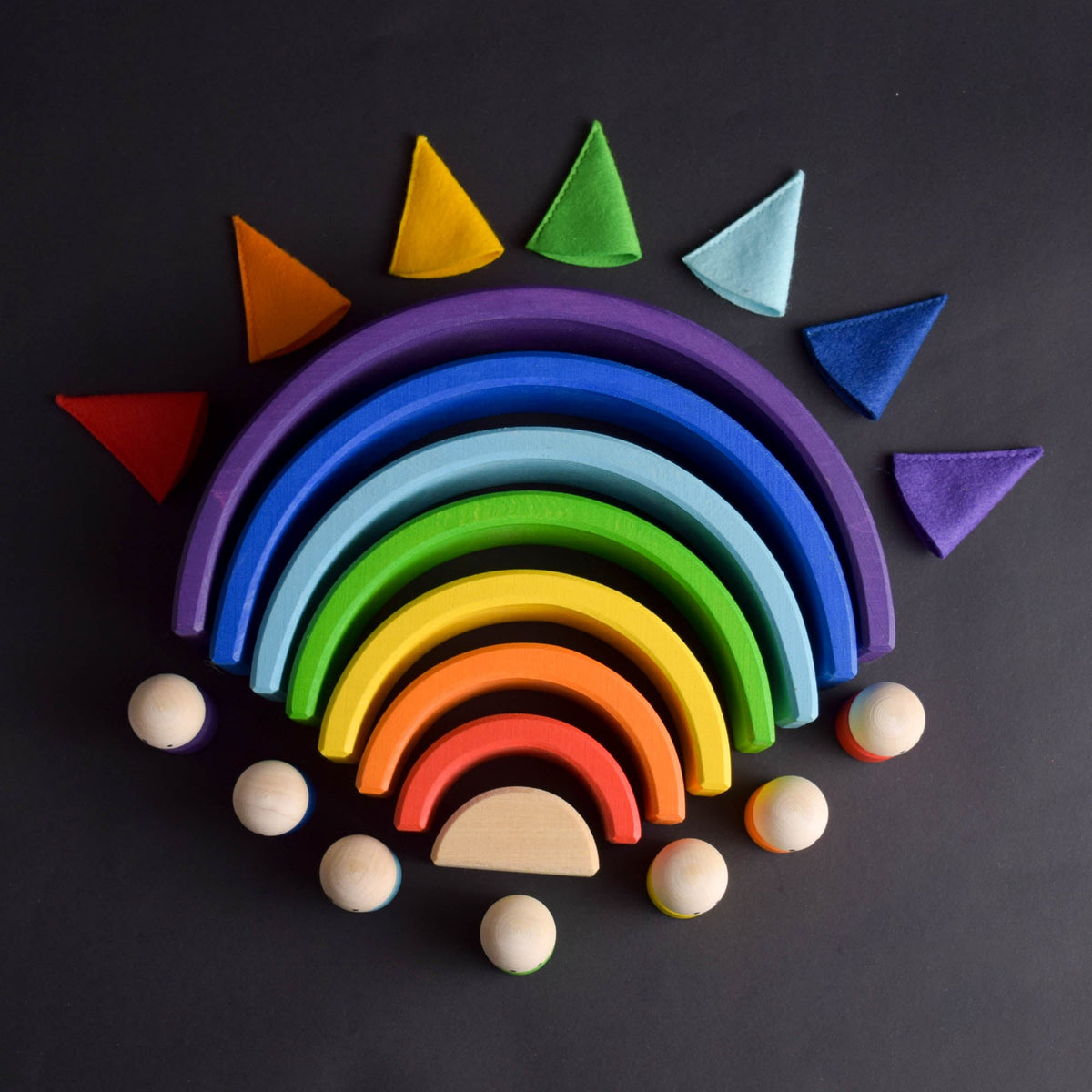 Handmade Montessori rainbow building toy in linden wood and plywood with a natural wax-and-oil finish
