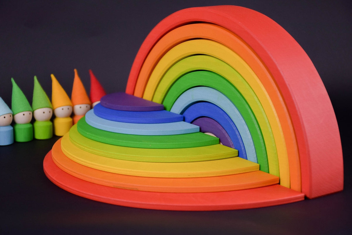 Handmade Montessori rainbow building toy in linden wood and plywood with a natural wax-and-oil finish