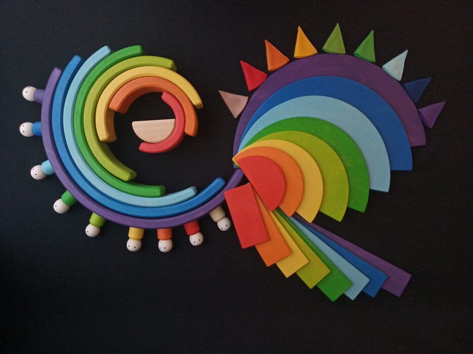Handmade Montessori rainbow building toy in linden wood and plywood with a natural wax-and-oil finish