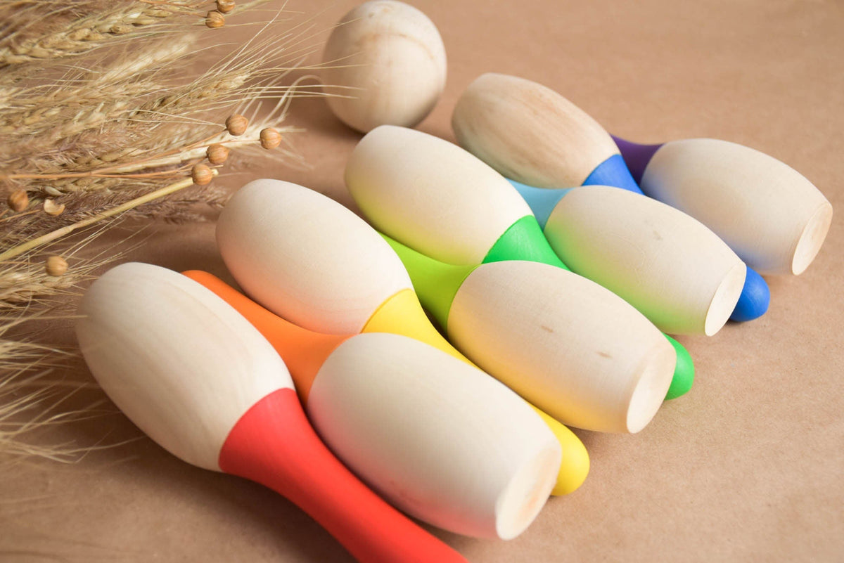 Mini bowling game with colorful wooden pins