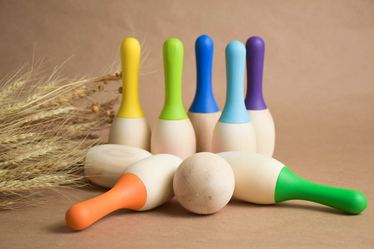 Mini bowling game with colorful wooden pins