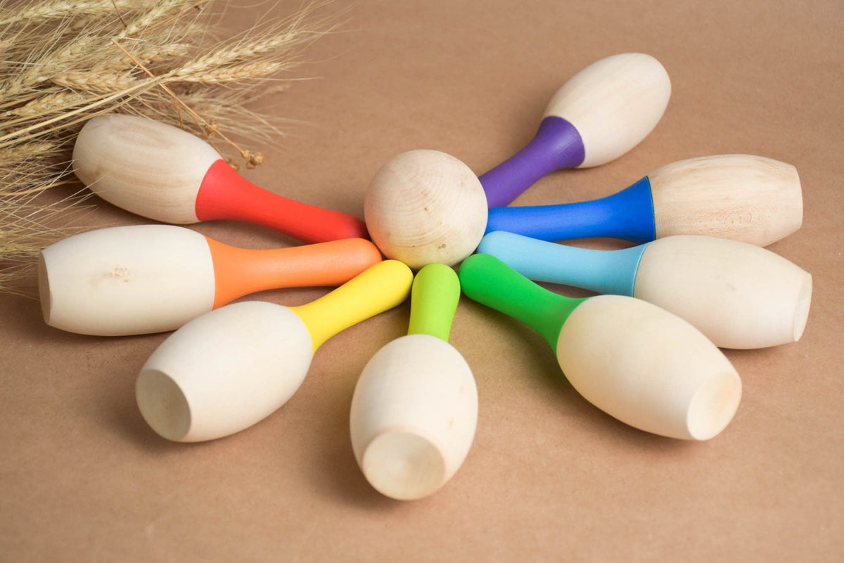 Rainbow-colored wooden skittles set