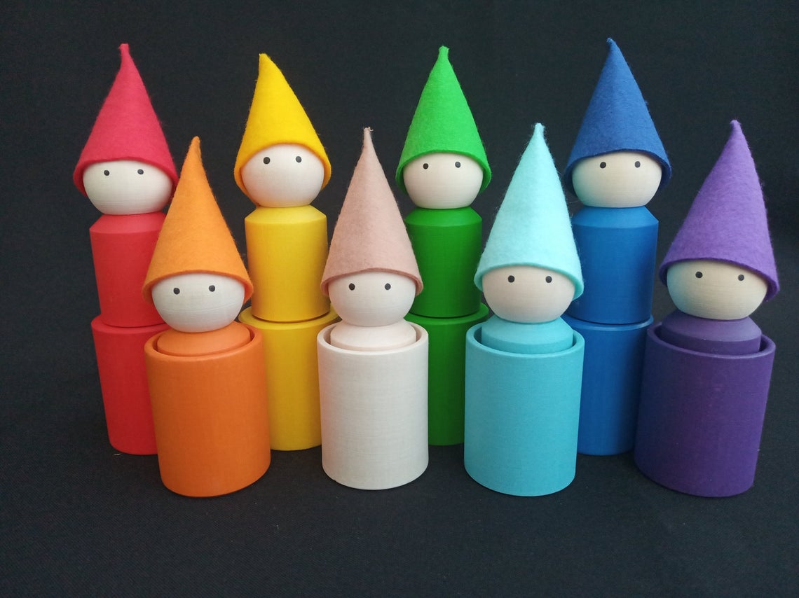 Rainbow wooden peg dolls with hats and cups