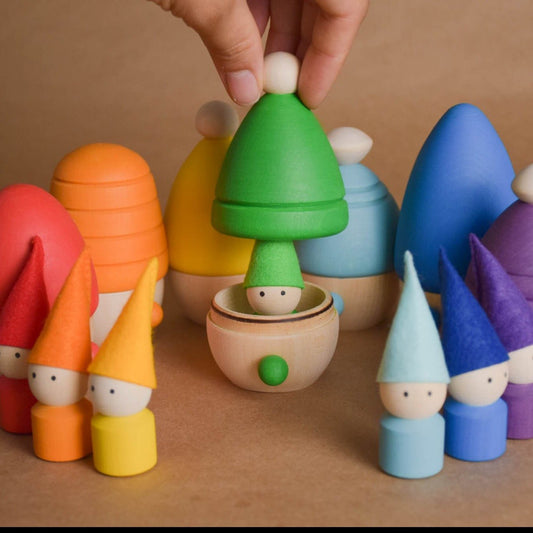 Rainbow wooden peg dolls with opening houses