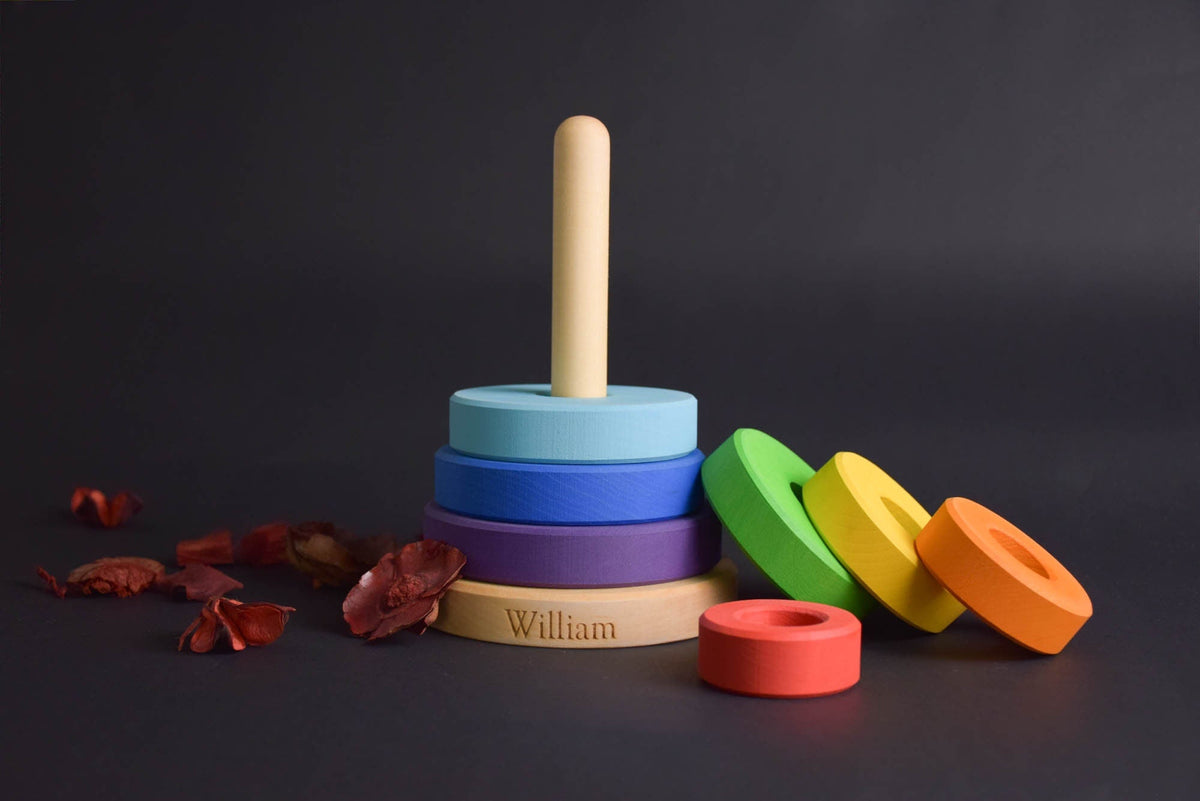 Linden wood ring stacker with rainbow-colored rings