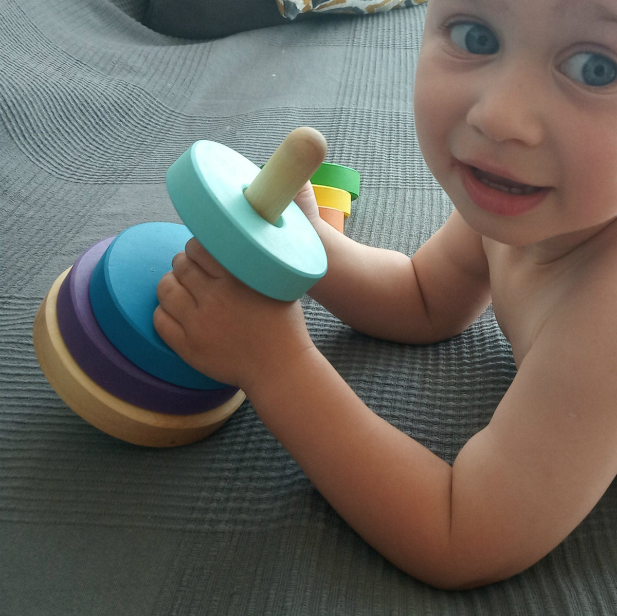 Linden wood stacking rings toy with rainbow-colored rings