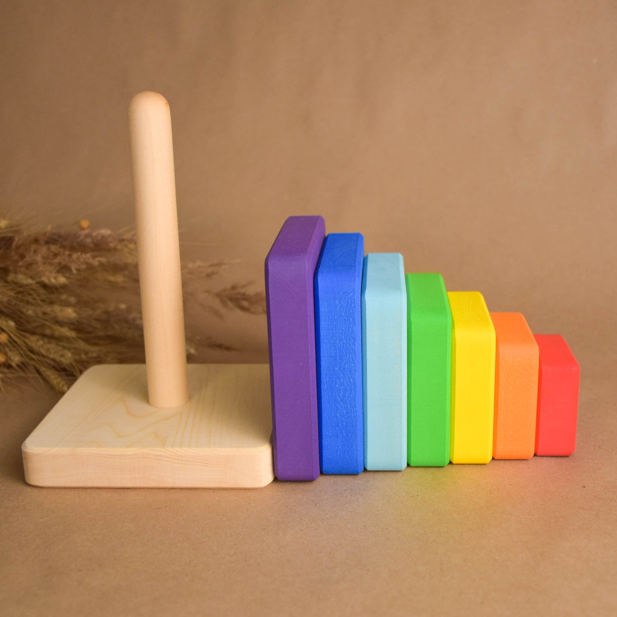 Linden wood stacking toy with square rings