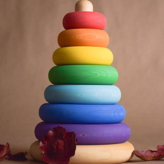 Wooden stacking toy with turned rings