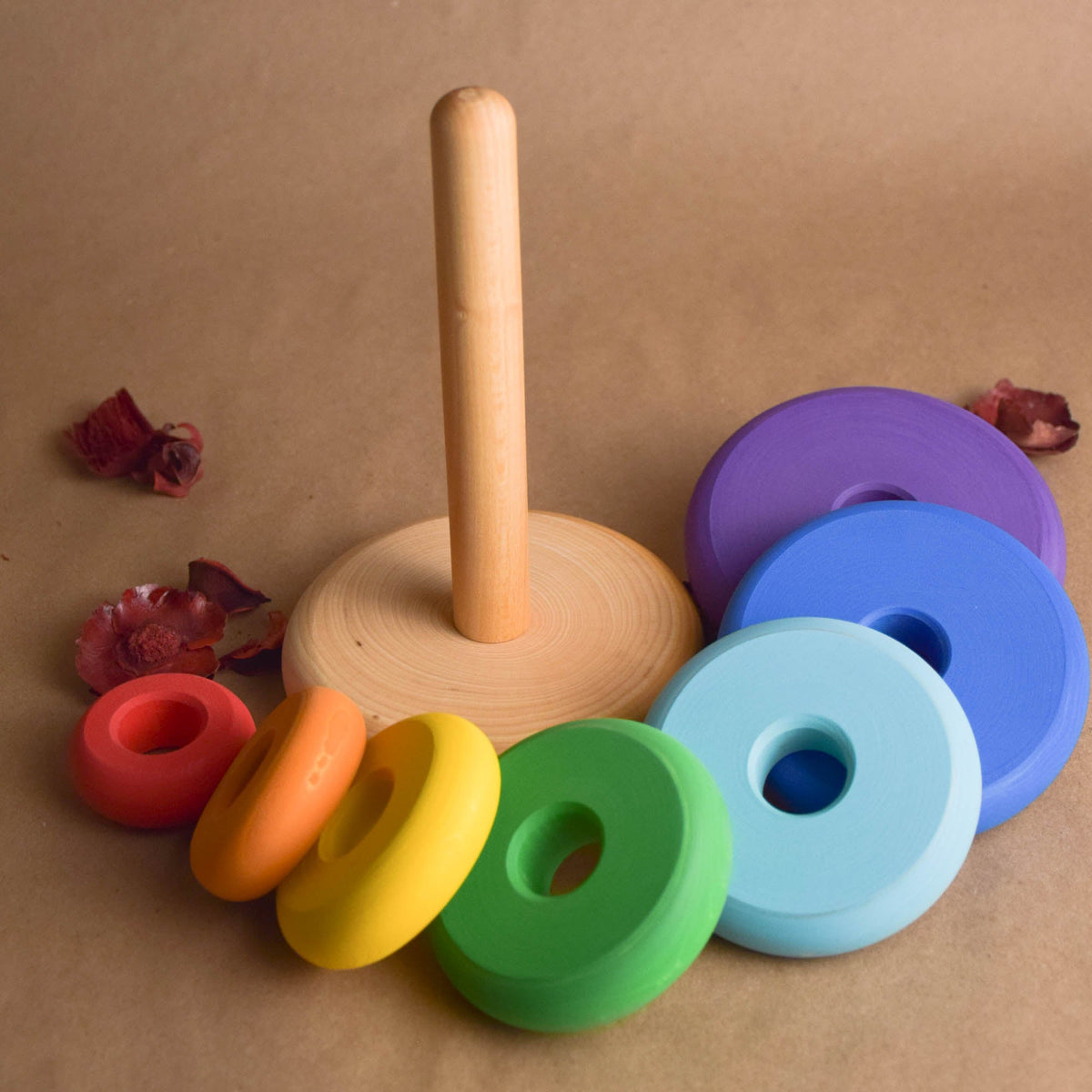 Wooden stacking toy with turned rings