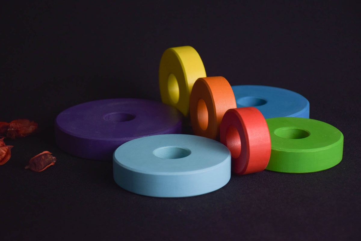 Ring stacking toy made from wood, with turned rings