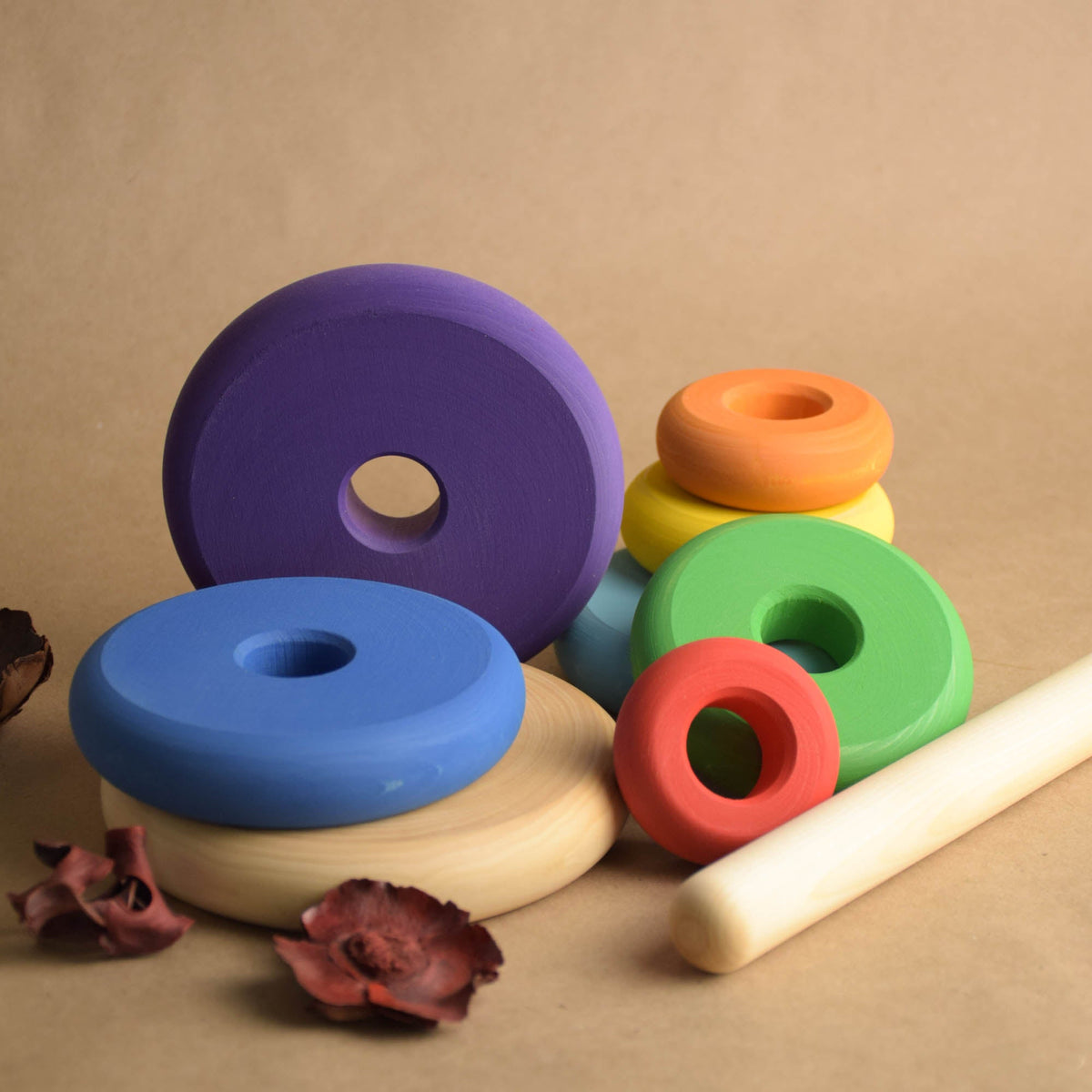 Ring stacking toy made from wood, with turned rings