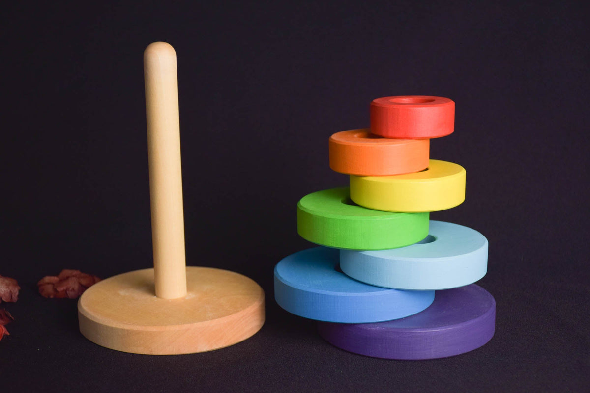 Wooden ring stacker with turned rings