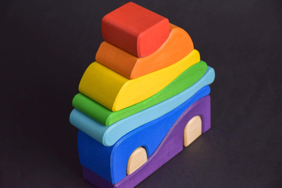 Handmade Montessori house-shaped nesting toy in linden wood with a natural colored wax finish