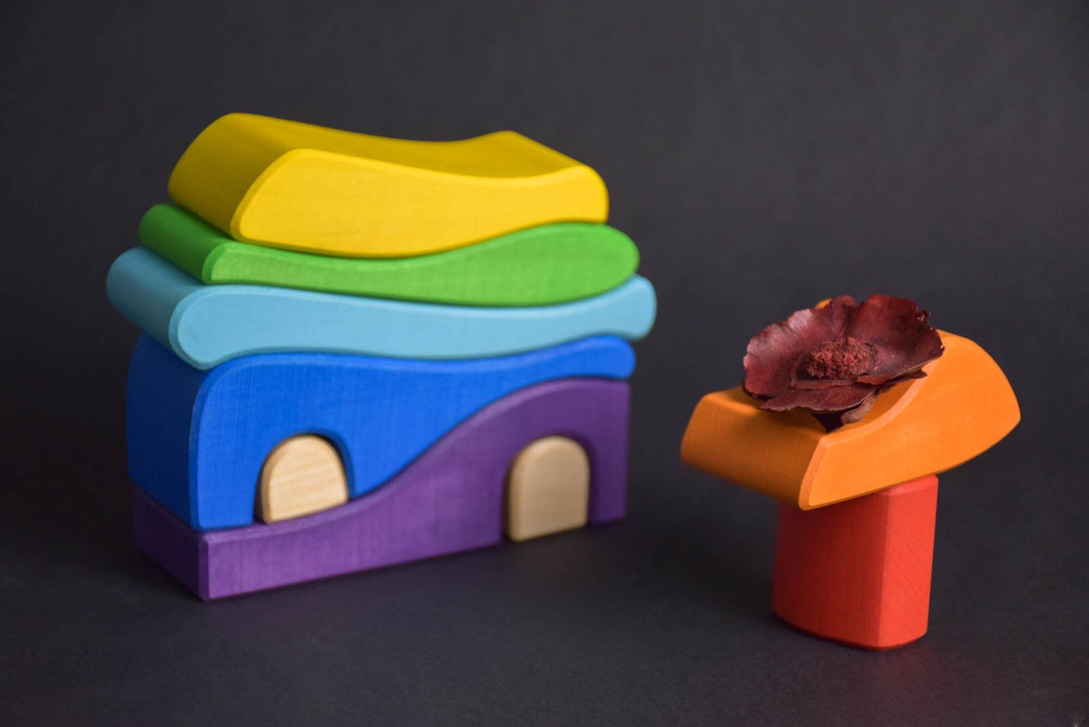 Handmade Montessori house-shaped nesting toy in linden wood with a natural colored wax finish