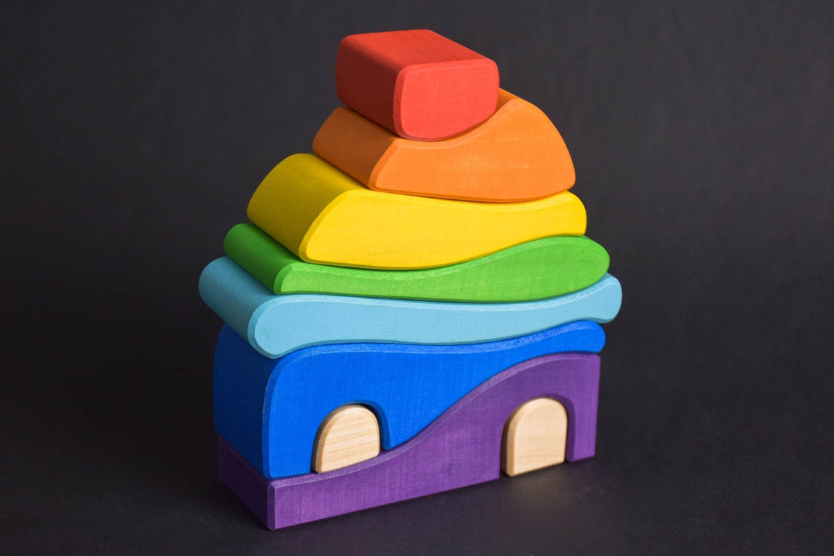 Handmade Montessori house-shaped nesting toy in linden wood with a natural colored wax finish