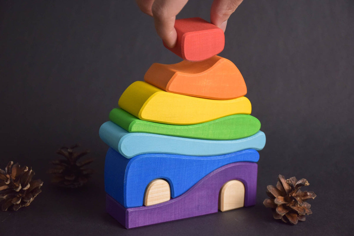 Handmade Montessori house-shaped nesting toy in linden wood with a natural colored wax finish