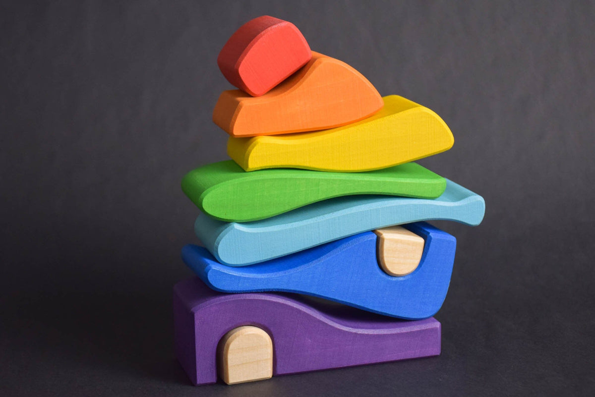 Handmade Montessori house-shaped nesting toy in linden wood with a natural colored wax finish