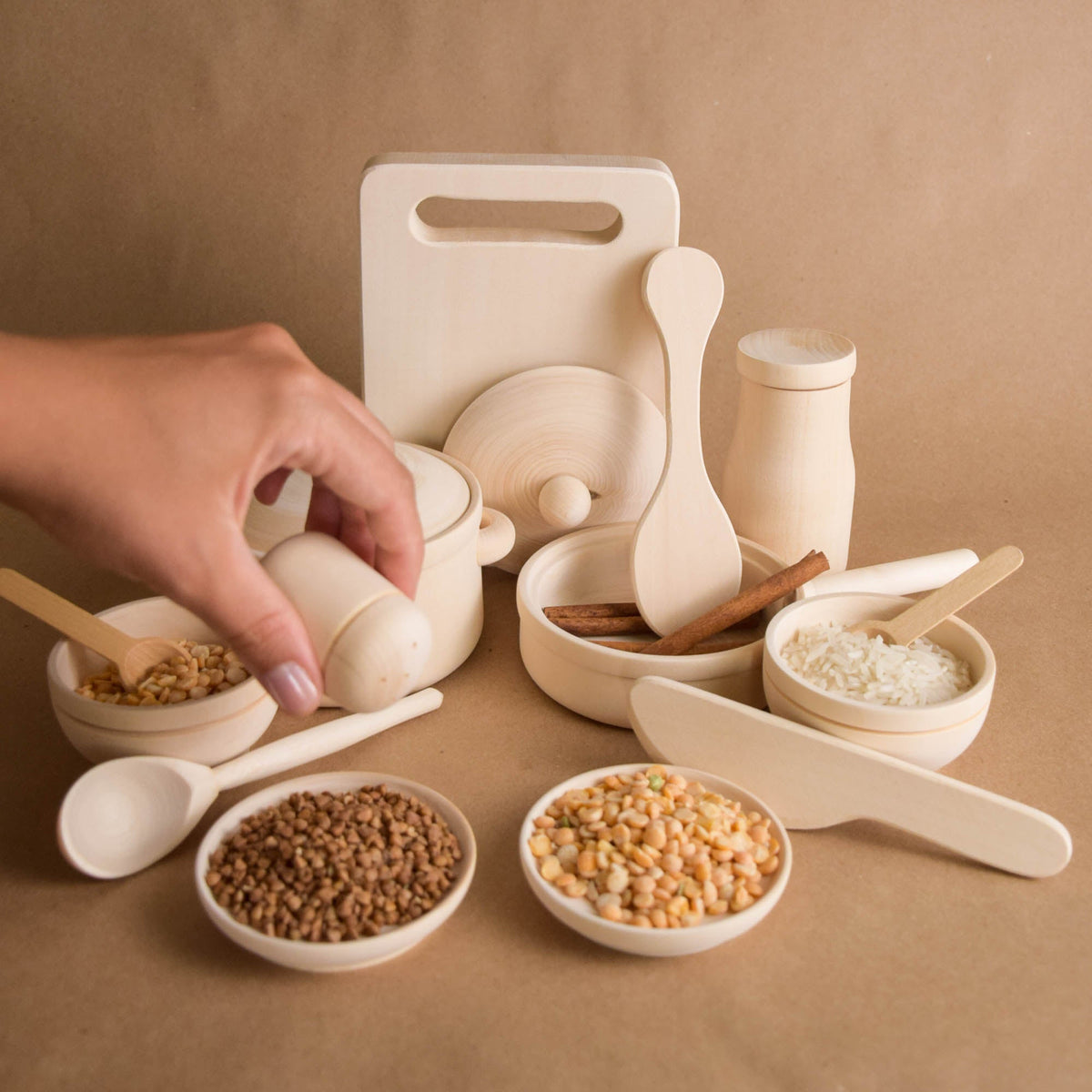 Handmade natural wooden play dishes for Montessori-inspired play, crafted from solid wood