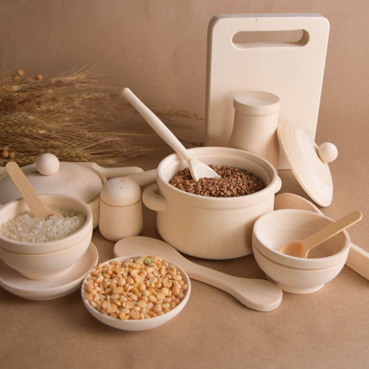 Handmade natural wooden play dishes for Montessori-inspired play, crafted from solid wood