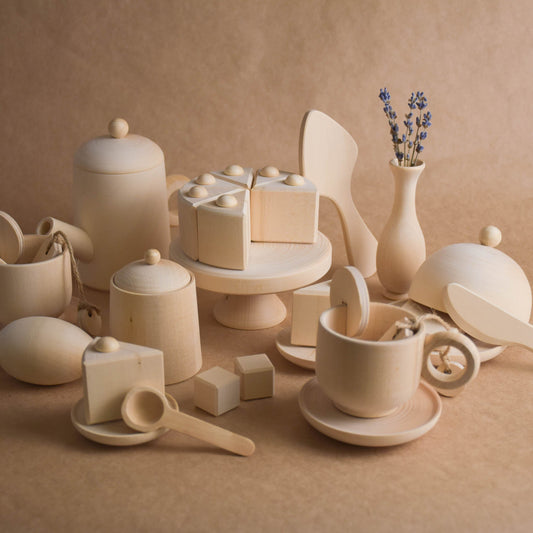 Handmade wooden tea and cake play set for Montessori-inspired play, crafted from natural solid wood