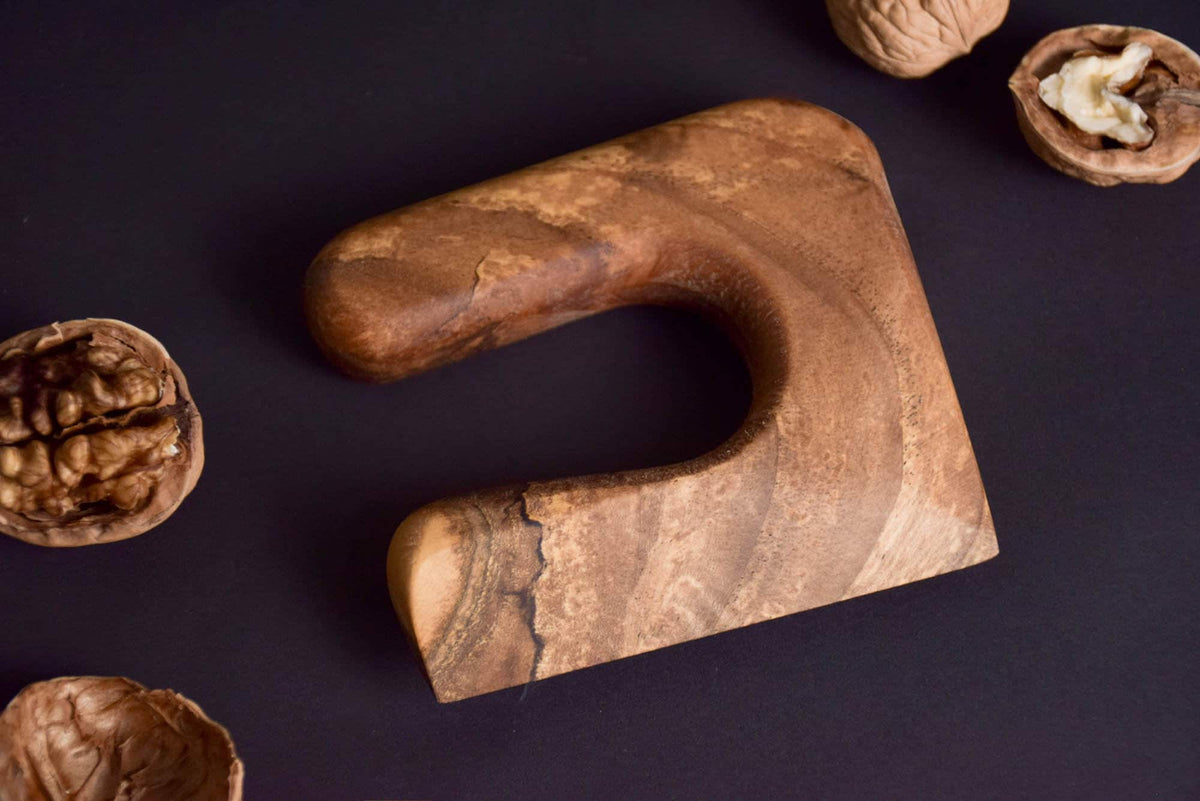 Handmade Montessori cutting knife in solid walnut wood with a natural oil finish
