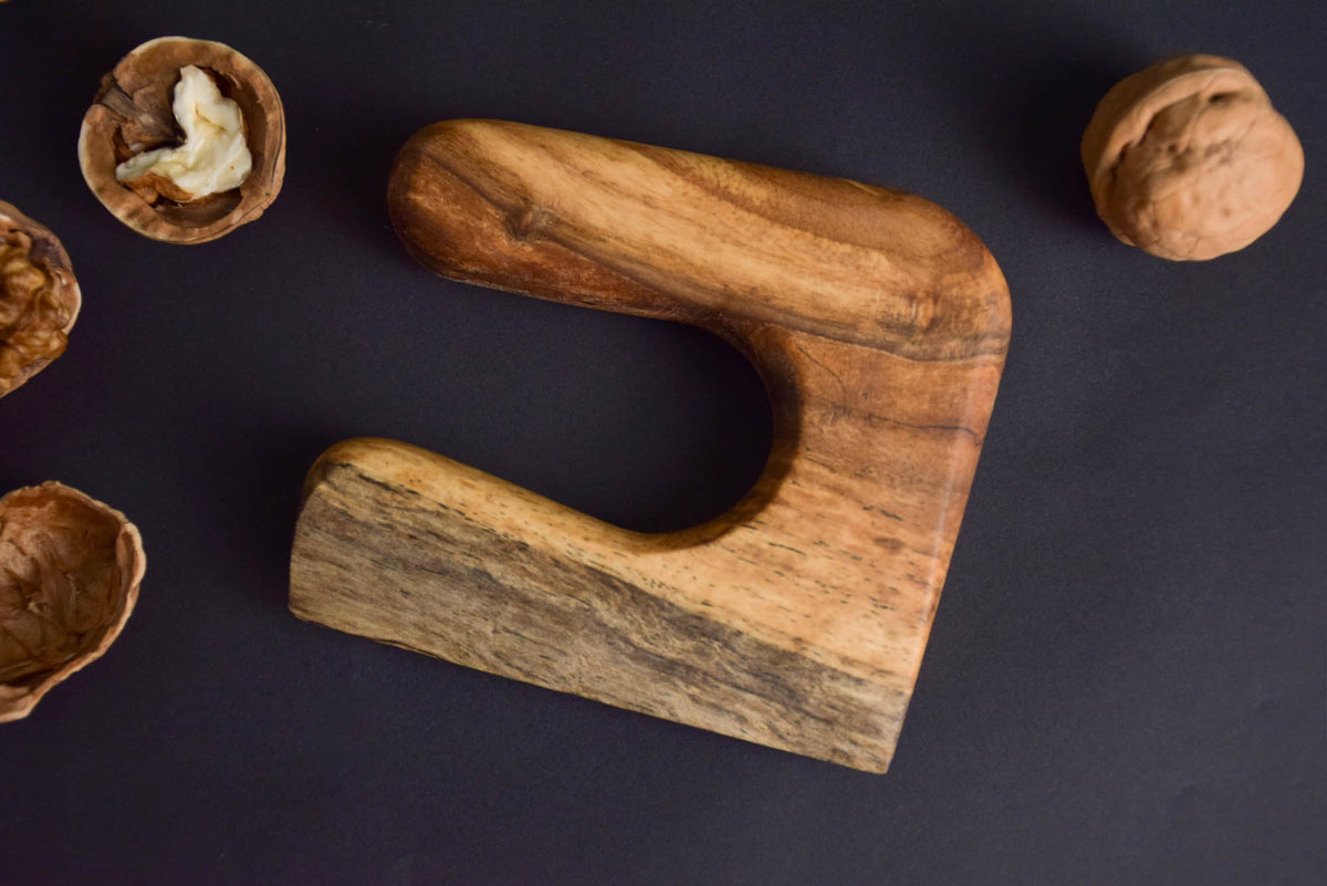 Handmade Montessori cutting knife in solid walnut wood with a natural oil finish