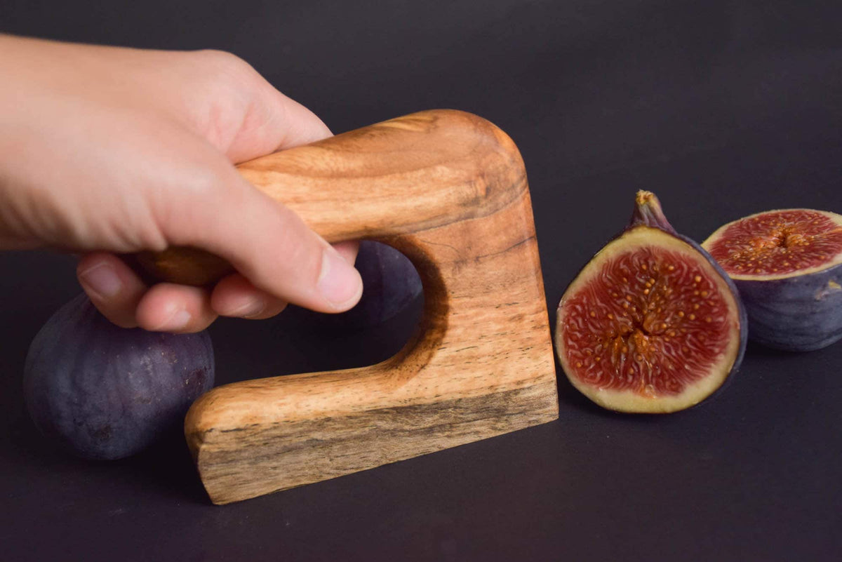 Handmade Montessori cutting knife in solid walnut wood with a natural oil finish