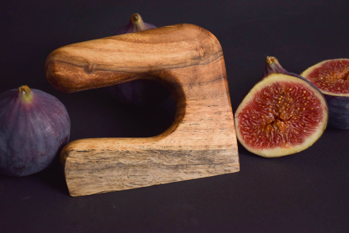 Handmade Montessori cutting knife in solid walnut wood with a natural oil finish