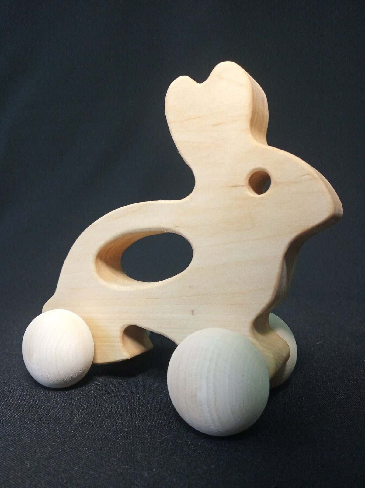 Wooden rabbit push toy in linden wood