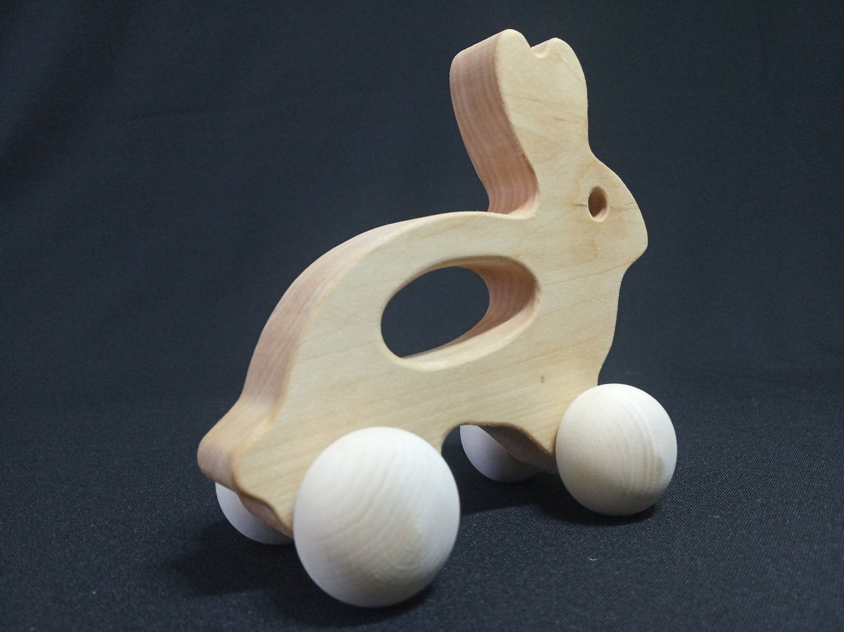 Wooden rabbit push toy in linden wood