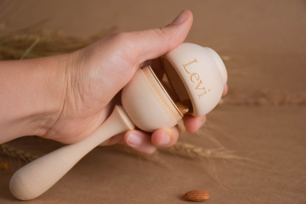 Wooden baby maraca rattle made from linden wood
