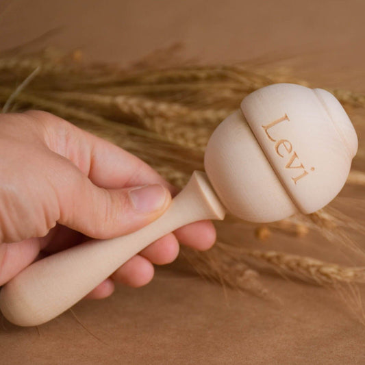 Wooden baby maraca rattle made from linden wood